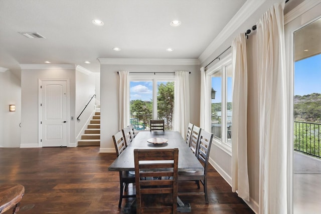 dining space with stairway, plenty of natural light, dark wood finished floors, and visible vents