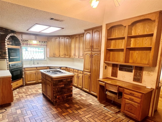 kitchen with a sink, open shelves, black appliances, and a textured ceiling