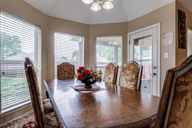 dining space featuring a chandelier
