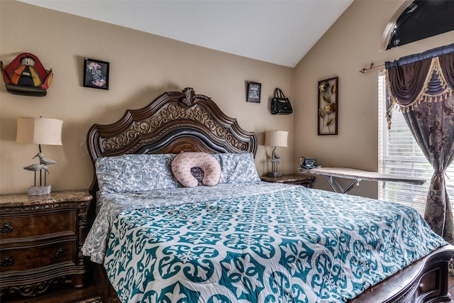 bedroom with lofted ceiling