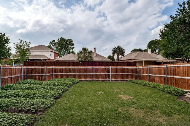 view of yard with a fenced backyard