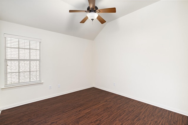 empty room featuring a ceiling fan, baseboards, dark wood-style floors, and a healthy amount of sunlight