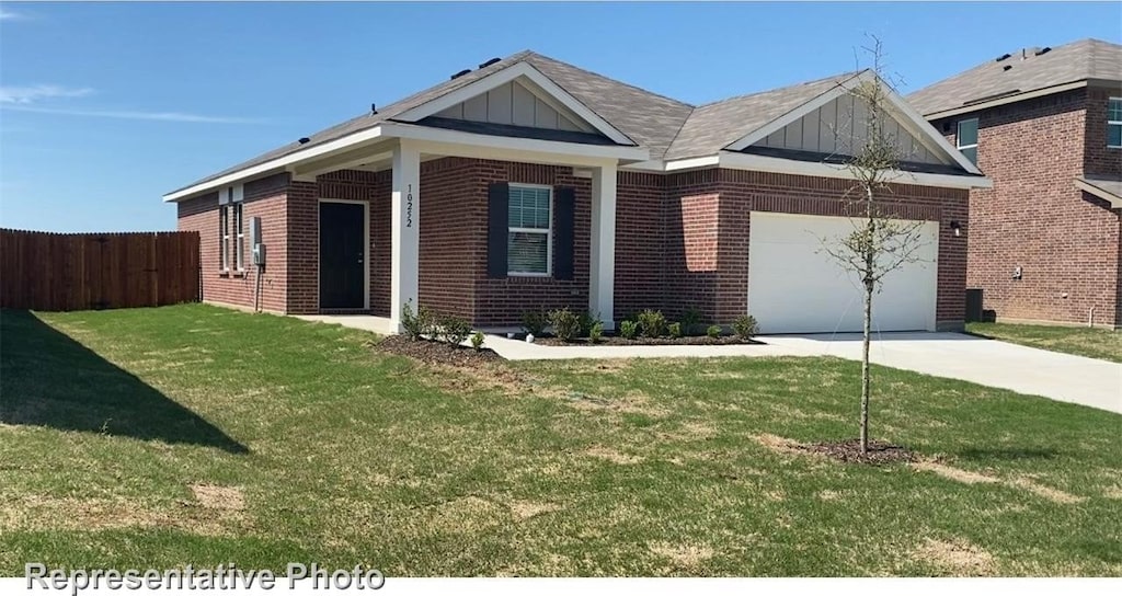 view of front of home featuring board and batten siding, driveway, a garage, brick siding, and fence