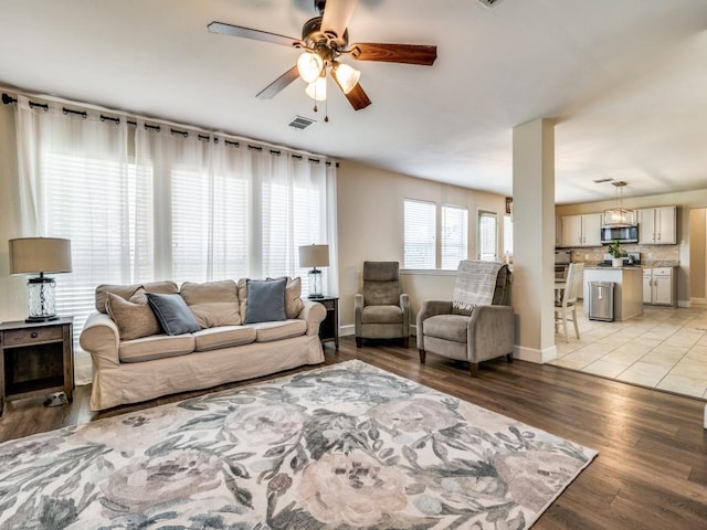 300 Aspenwood Trl, Forney, TX 75126 - living area with visible vents, light wood-style floors, ceiling fan, and baseboards
