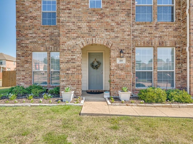 300 Aspenwood Trl, Forney, TX 75126 - doorway to property featuring a lawn and brick siding