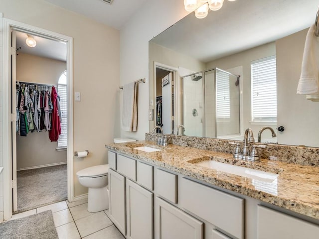 300 Aspenwood Trl, Forney, TX 75126 - full bathroom featuring a sink, a shower stall, and a spacious closet
