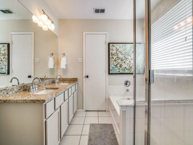 300 Aspenwood Trl, Forney, TX 75126 - full bathroom featuring visible vents, a sink, a bath, and tile patterned floors
