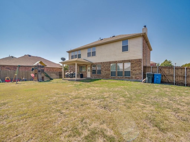 300 Aspenwood Trl, Forney, TX 75126 - rear view of house featuring brick siding, a fenced backyard, a chimney, a playground, and a lawn