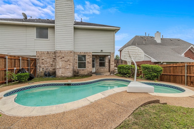 view of swimming pool with a fenced backyard and a fenced in pool