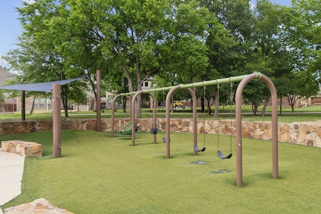 community playground featuring a lawn