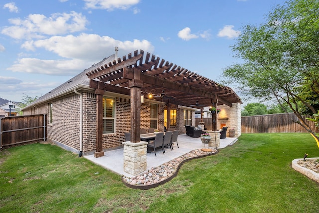 back of house with a lawn, a fenced backyard, a pergola, and brick siding