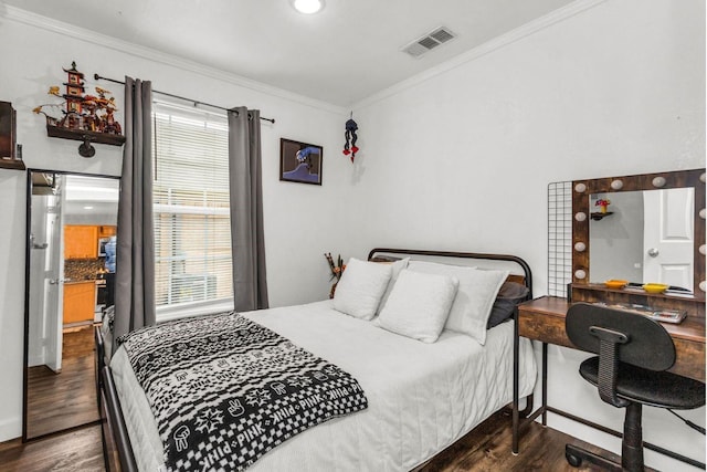 bedroom featuring visible vents, ornamental molding, dark wood-style floors, and multiple windows