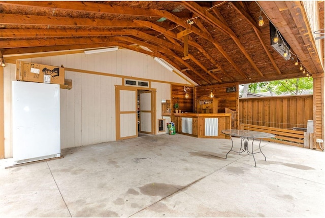 garage featuring wooden walls