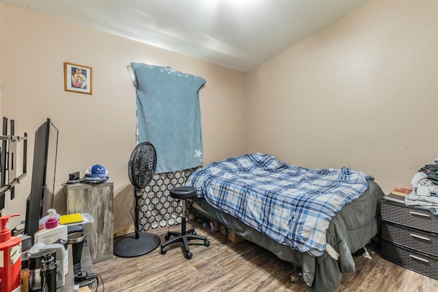 bedroom featuring wood finished floors