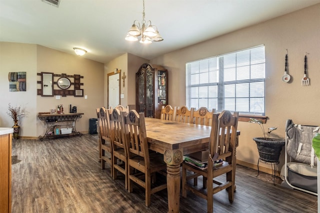 dining space with baseboards, a chandelier, and dark wood-style floors
