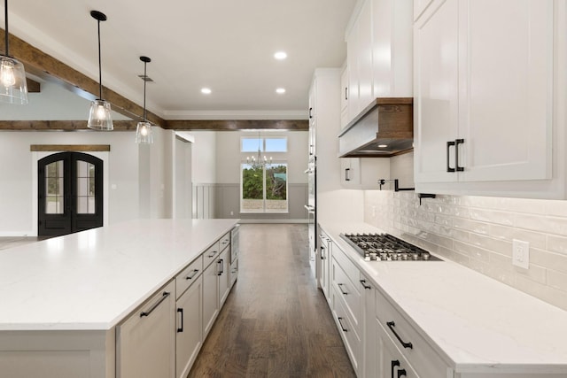 8408 Fullerton Dr, Cleburne, TX 76033 - kitchen featuring a kitchen island, premium range hood, white cabinetry, dark wood finished floors, and appliances with stainless steel finishes