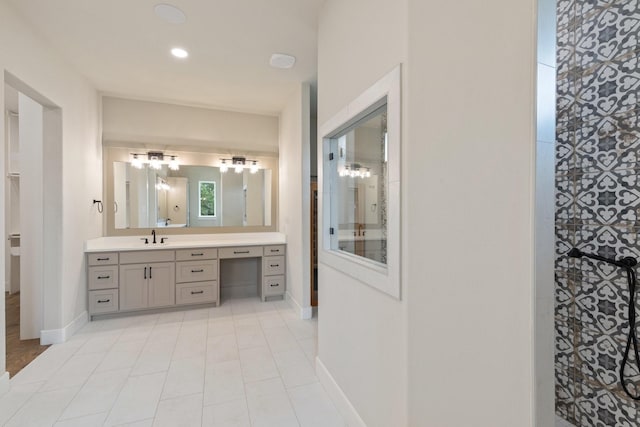 8408 Fullerton Dr, Cleburne, TX 76033 - bathroom featuring vanity, baseboards, recessed lighting, tile patterned floors, and a chandelier