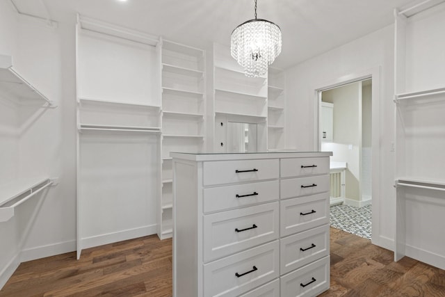 8408 Fullerton Dr, Cleburne, TX 76033 - walk in closet with dark wood-style flooring and a notable chandelier