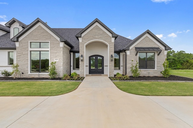 8408 Fullerton Dr, Cleburne, TX 76033 - view of front of house with a shingled roof, a front lawn, french doors, and stone siding