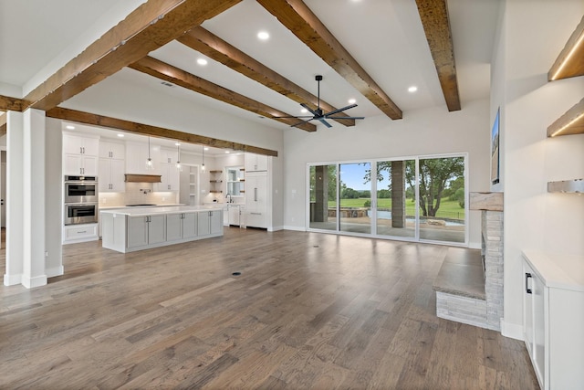 8408 Fullerton Dr, Cleburne, TX 76033 - unfurnished living room with beam ceiling, a fireplace, a chandelier, baseboards, and wood finished floors