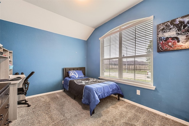 bedroom featuring carpet floors, baseboards, and vaulted ceiling
