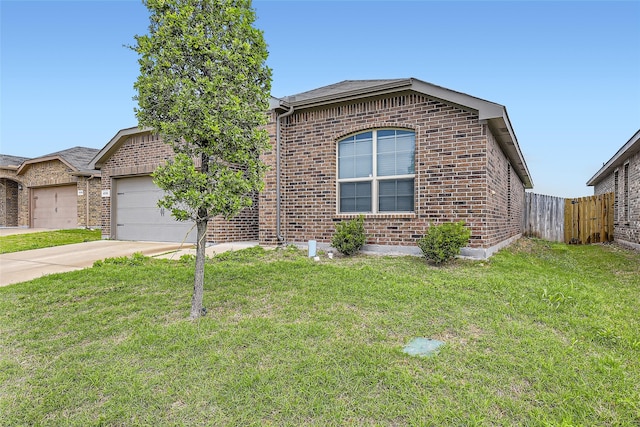 single story home featuring a garage, a front lawn, fence, brick siding, and driveway