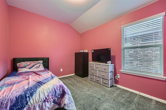 bedroom featuring dark colored carpet, baseboards, vaulted ceiling, and multiple windows