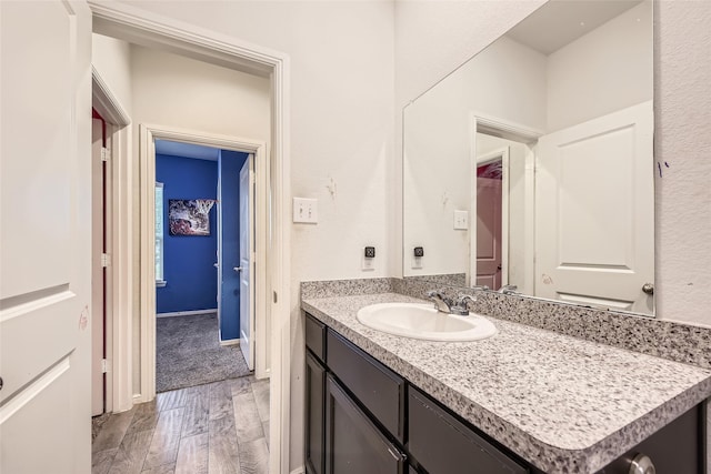 bathroom featuring vanity and wood finished floors