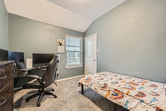 bedroom featuring a textured wall, vaulted ceiling, baseboards, and carpet