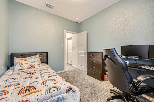 bedroom featuring carpet floors, a textured wall, lofted ceiling, and visible vents
