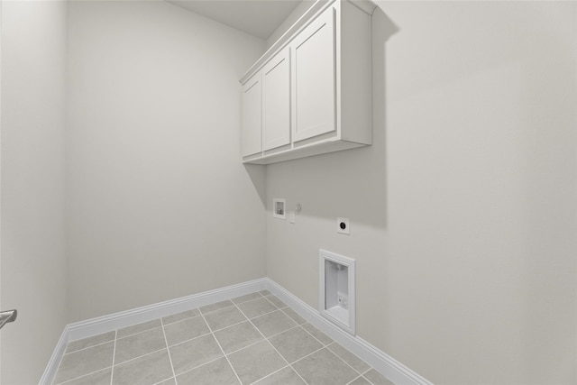 laundry area featuring cabinet space, light tile patterned flooring, washer hookup, hookup for a gas dryer, and hookup for an electric dryer