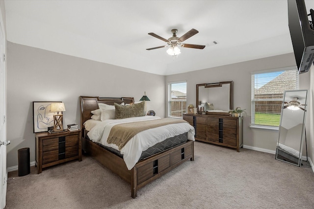 bedroom with baseboards, ceiling fan, carpet, and visible vents