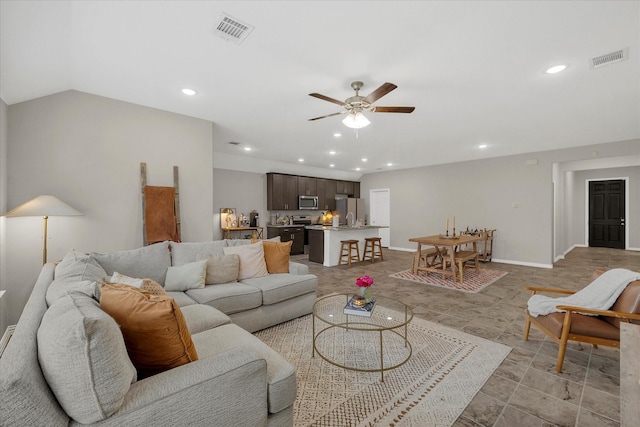 living room with visible vents, a ceiling fan, and recessed lighting