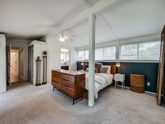 bedroom with vaulted ceiling with beams, ceiling fan, and light colored carpet