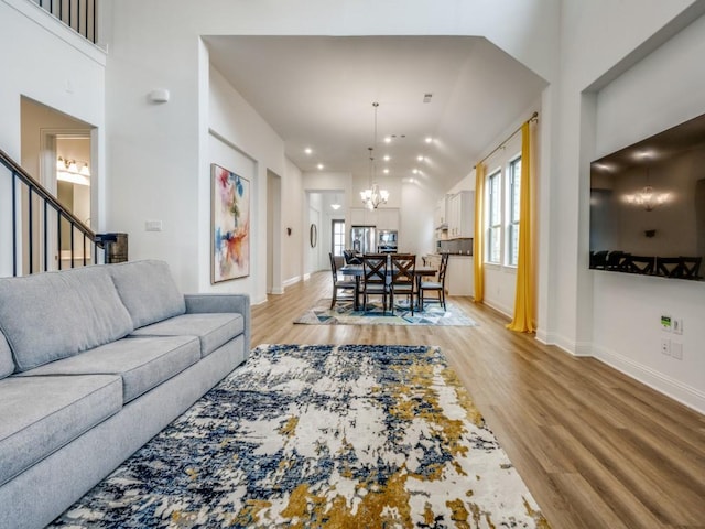 2513 Silver Leaf Dr, Northlake, TX 76226 - living room featuring stairs, light wood-style floors, baseboards, recessed lighting, and a chandelier