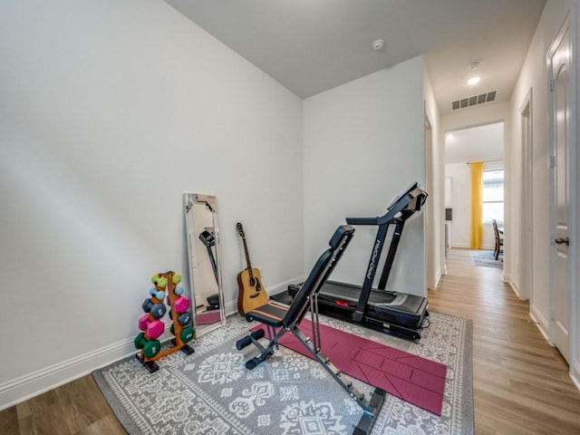2513 Silver Leaf Dr, Northlake, TX 76226 - workout room featuring baseboards, visible vents, and wood finished floors