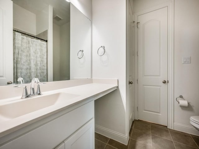 2513 Silver Leaf Dr, Northlake, TX 76226 - full bath with visible vents, vanity, baseboards, tile patterned floors, and toilet