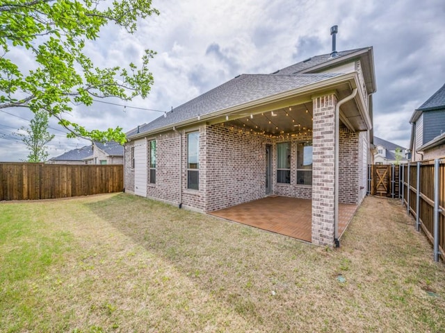 2513 Silver Leaf Dr, Northlake, TX 76226 - back of property with a yard, brick siding, a patio, and a fenced backyard