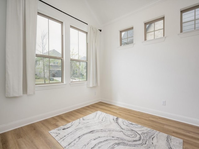 2513 Silver Leaf Dr, Northlake, TX 76226 - spare room with baseboards, ornamental molding, wood finished floors, and lofted ceiling