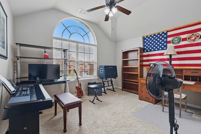 carpeted office with ceiling fan, visible vents, baseboards, and vaulted ceiling