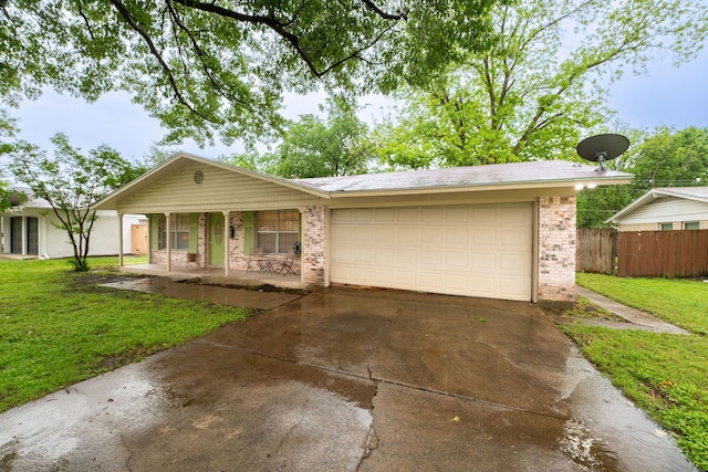 ranch-style home with a porch, fence, a front yard, and brick siding