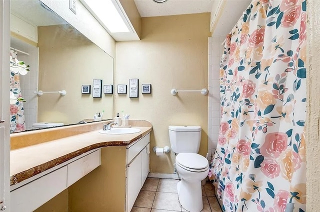 full bath with a shower with curtain, tile patterned floors, vanity, and toilet