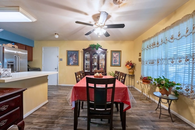 dining room with baseboards, a ceiling fan, dark wood finished floors, and visible vents