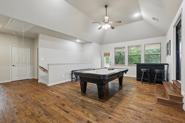 playroom featuring ceiling fan, attic access, wood finished floors, vaulted ceiling, and a bar