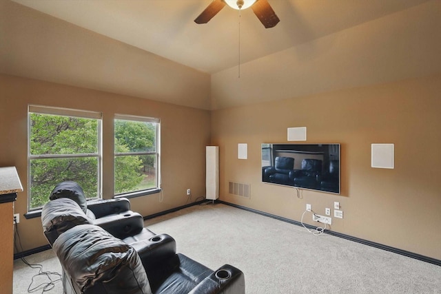 living area featuring visible vents, carpet flooring, baseboards, and ceiling fan
