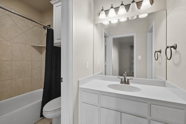 bathroom with vanity, toilet, and shower / tub combo