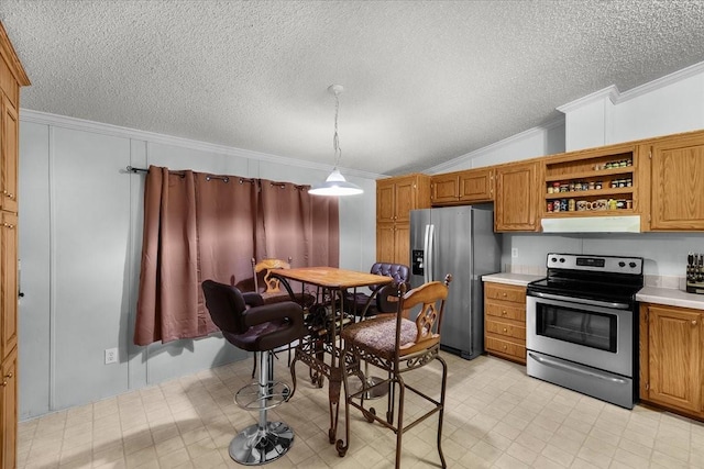 kitchen featuring a textured ceiling, light countertops, light floors, ornamental molding, and stainless steel appliances