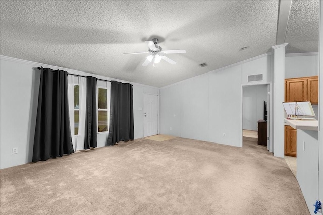 unfurnished living room featuring crown molding, visible vents, light colored carpet, a textured ceiling, and a ceiling fan