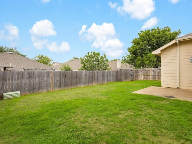 view of yard featuring a patio and a fenced backyard