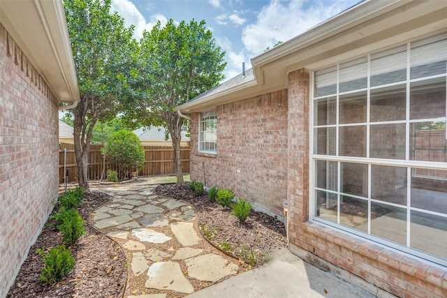 view of yard featuring fence and a patio area
